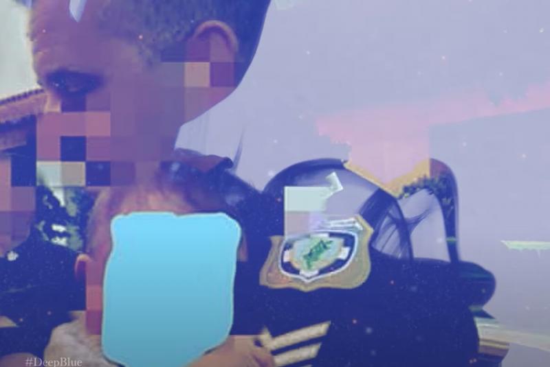 Ο αστυνομικός με το μωρό στην αγκαλιά του
